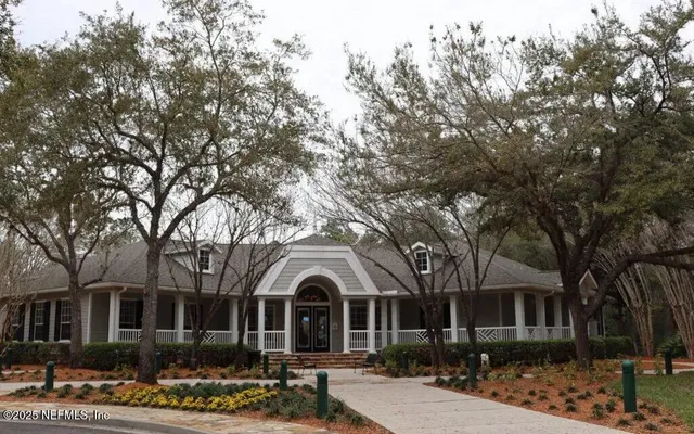 front view of a house with a garden