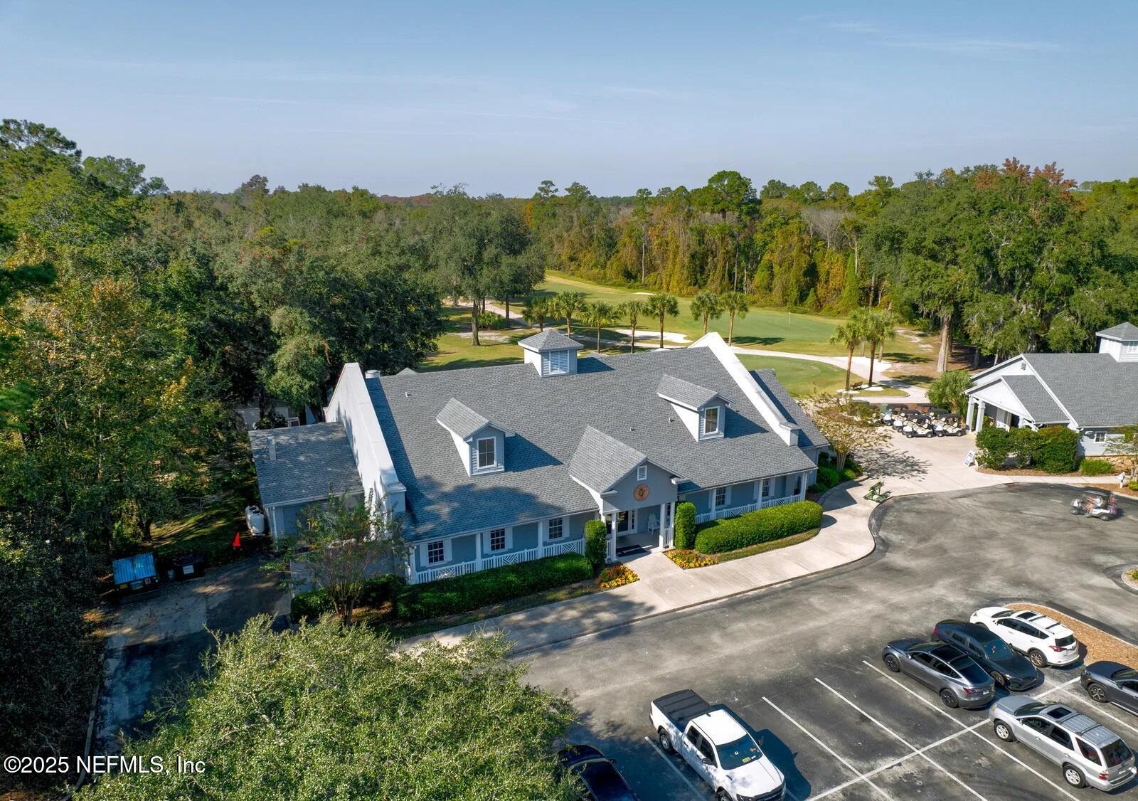 1500 Calming Water Drive, Unit 5703 Fleming Island, FL 32003 - Photo 13 of 17 an aerial view of a house with a big yard