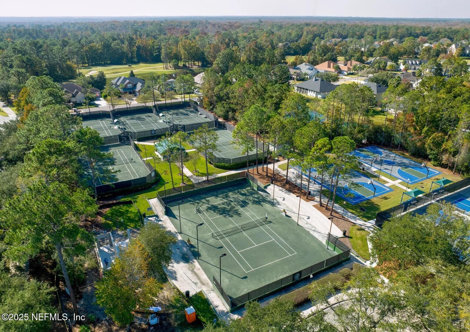 1500 Calming Water Drive, Unit 5703 Fleming Island, FL 32003 - Photo 17 of 17 an aerial view of a house with a garden