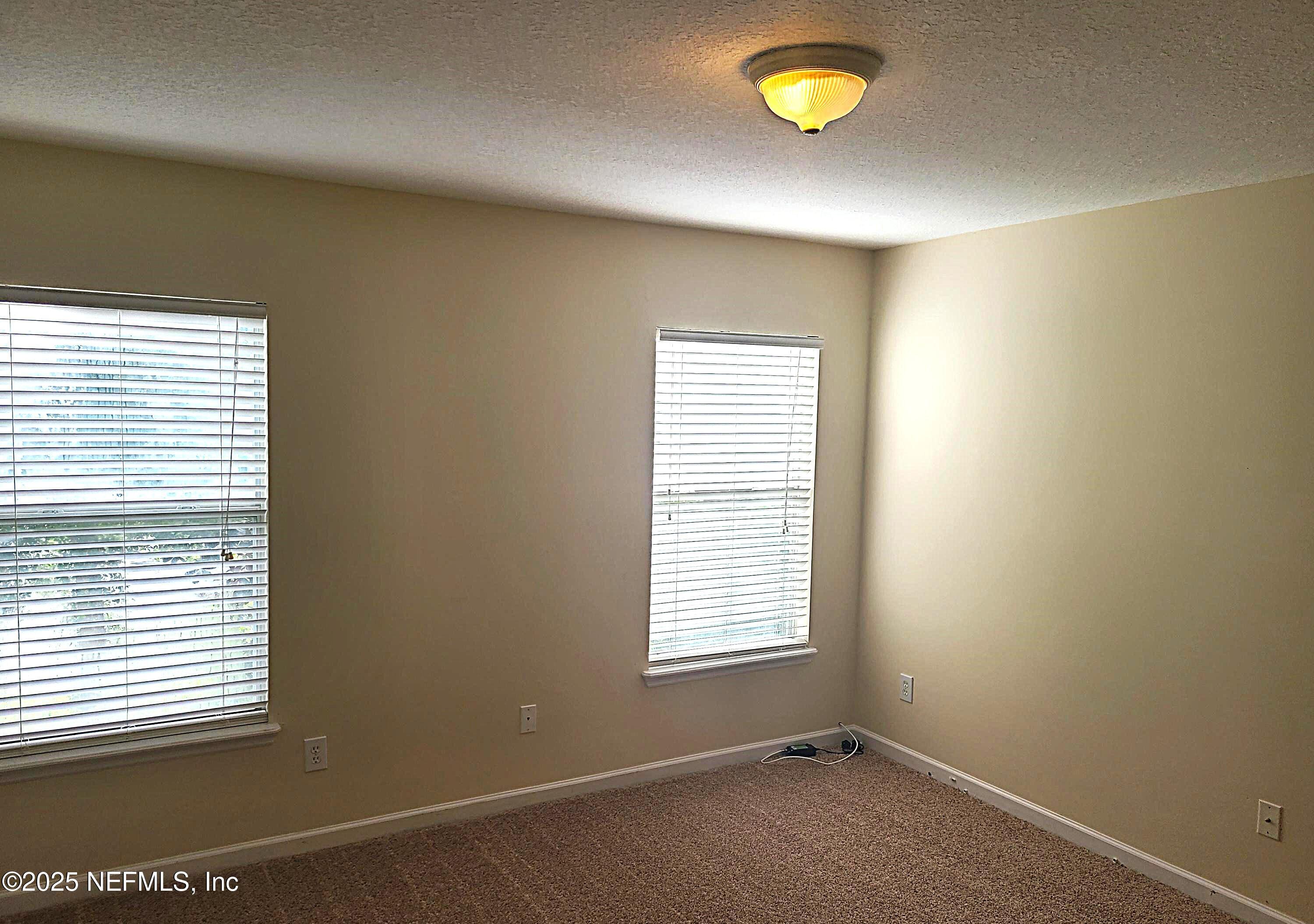 1500 Calming Water Drive, Unit 5703 Fleming Island, FL 32003 - Photo 5 of 17 a view of a window in a room