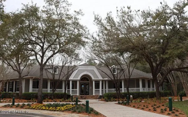 front view of a house with a garden