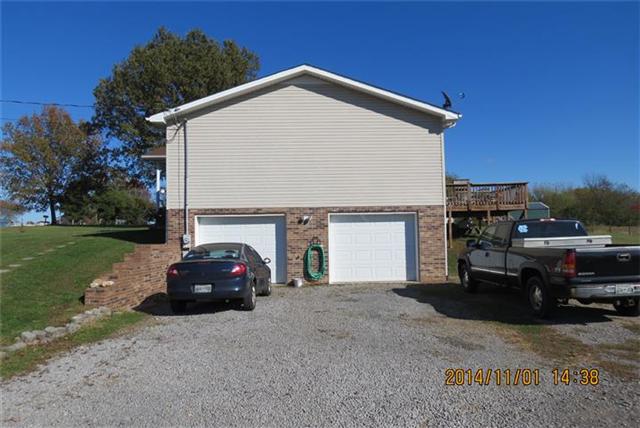 475 Hurricane Loop Tennessee Ridge, TN 37178 - Photo 4 of 20 2-car garage with one bay used as a workshop area