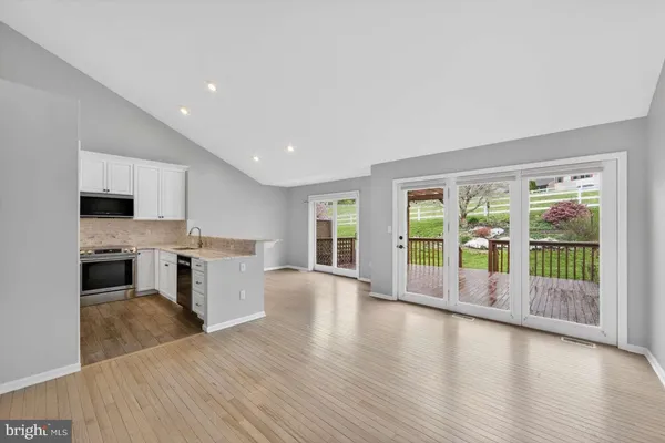 a kitchen with a stove a sink and a refrigerator