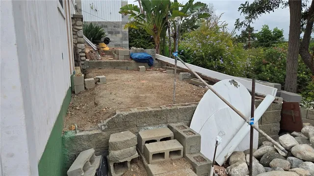 a view of a patio with table and chairs