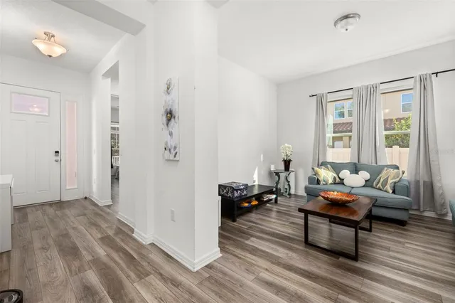 a living room with furniture and a window