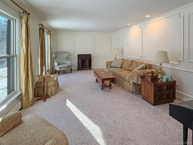 a bed room with furniture and a window