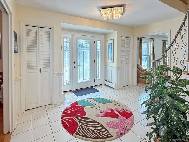 a bedroom with a bed and a potted plant