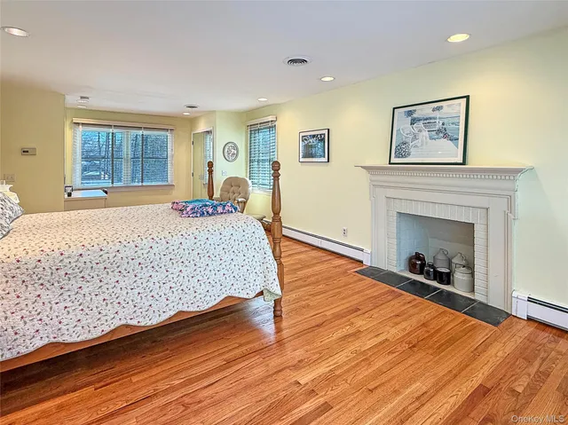 a bedroom with a bed and a fireplace