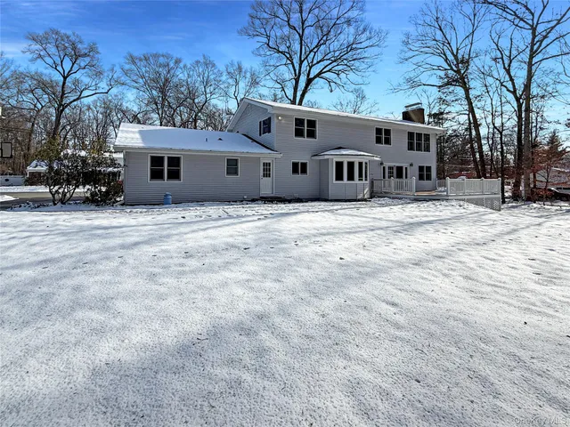 a house that has a tree in front of it