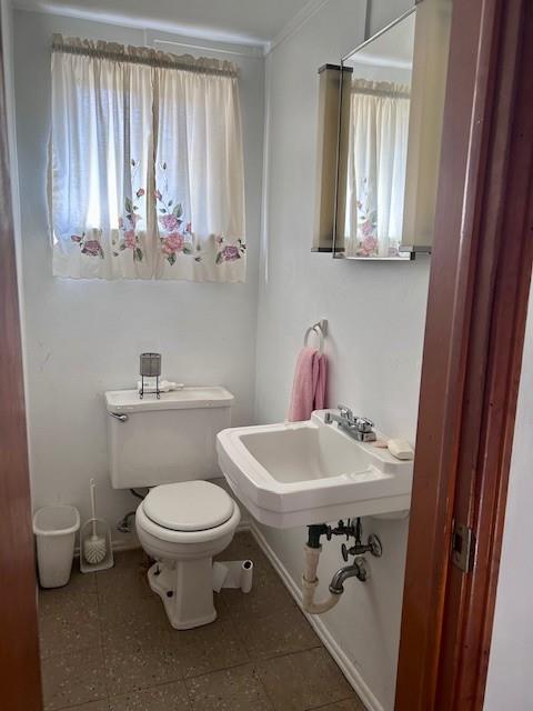 624 George Street Turtle Creek, PA 15145 - Photo 11 of 17 a bathroom with a sink a toilet and a mirror