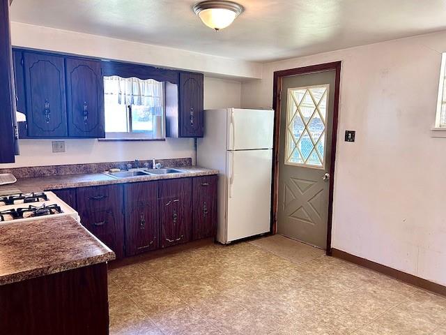 624 George Street Turtle Creek, PA 15145 - Photo 4 of 17 a kitchen with a refrigerator sink and cabinets
