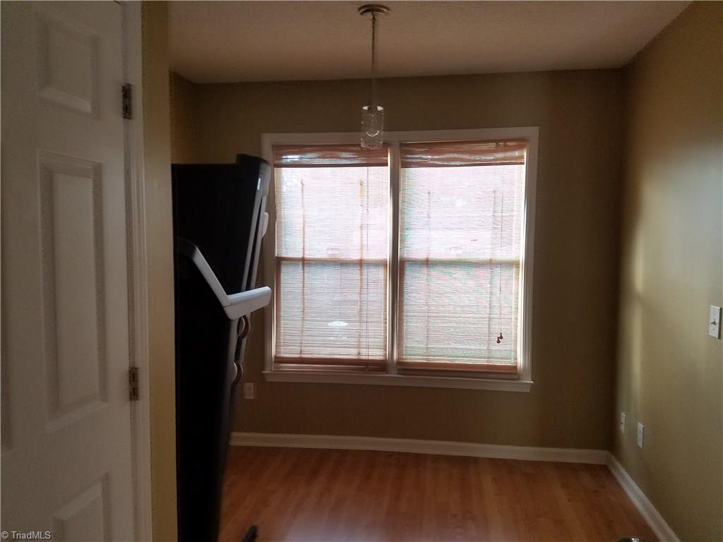 1113 Raleigh Court High Point, NC 27262 - Photo 5 of 8 Breakfast area - The black showing is a treadmill.