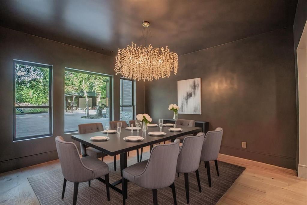 3100 East Melissa Road Melissa, TX 75454 - Photo 12 of 40 a view of a dining room with furniture a chandelier and wooden floor