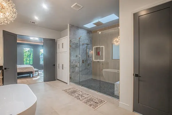 a bathroom with a bathtub and a shower