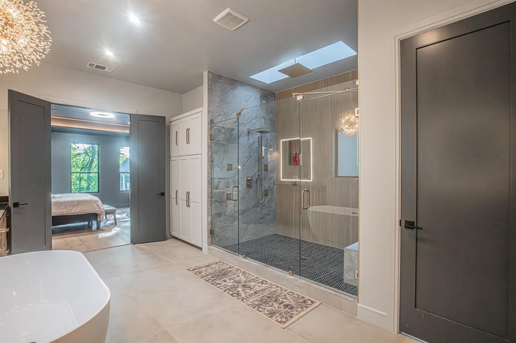 3100 East Melissa Road Melissa, TX 75454 - Photo 16 of 40 a bathroom with a bathtub and a shower