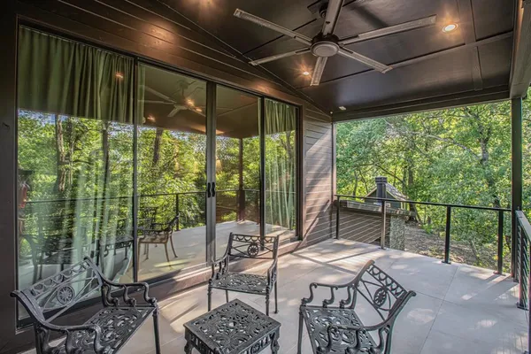 a view of a patio with a table chairs and a table