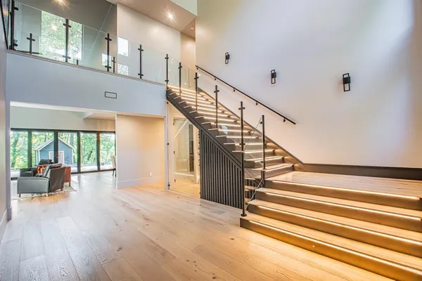 a view of entryway and hall with wooden floor