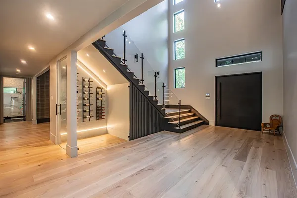 a view of an entryway with wooden floor