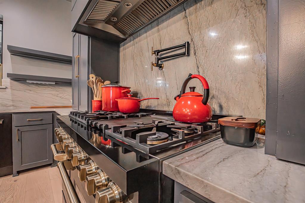 3100 East Melissa Road Melissa, TX 75454 - Photo 10 of 40 a stove top oven sitting inside of a kitchen
