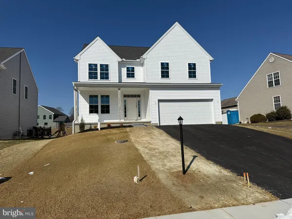 a view of a house with couches in front of it