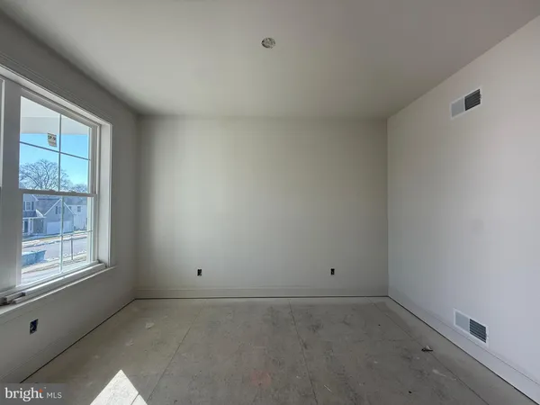 a view of empty room with windows