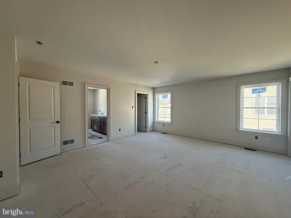 a room with a bed and a window