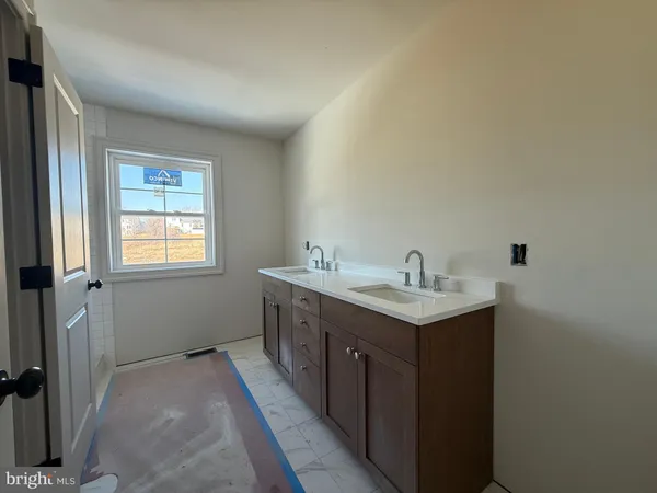 a bathroom with a glass shower door