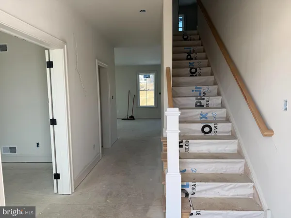 a view of a hallway with front door