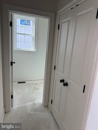 a room with a sink cabinets and utility room