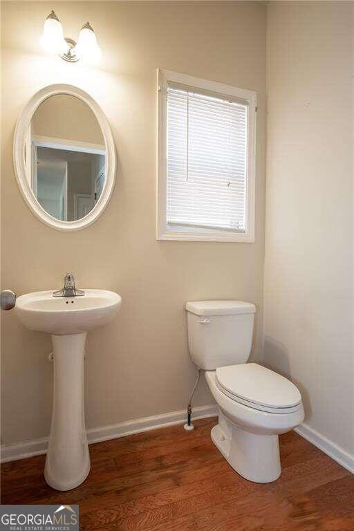 304 Ridge Pointe Drive Athens, GA 30606 - Photo 19 of 50 a bathroom with a toilet sink and mirror
