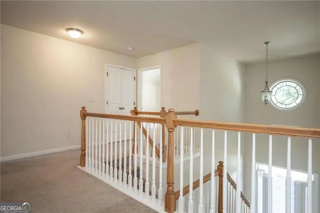 a view of a hallway with windows