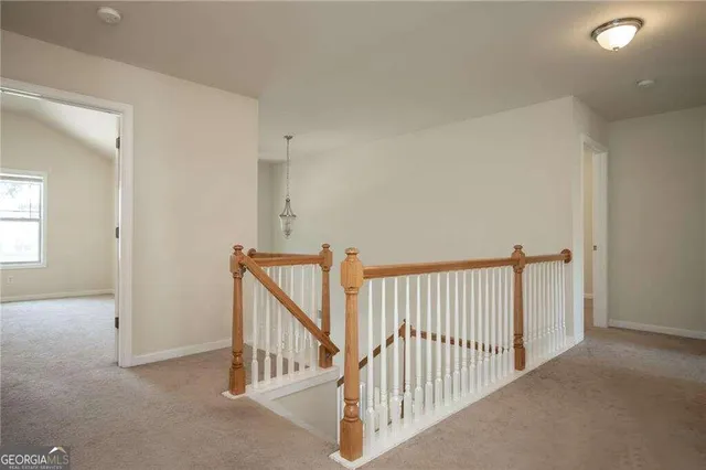 a view of a hallway with windows