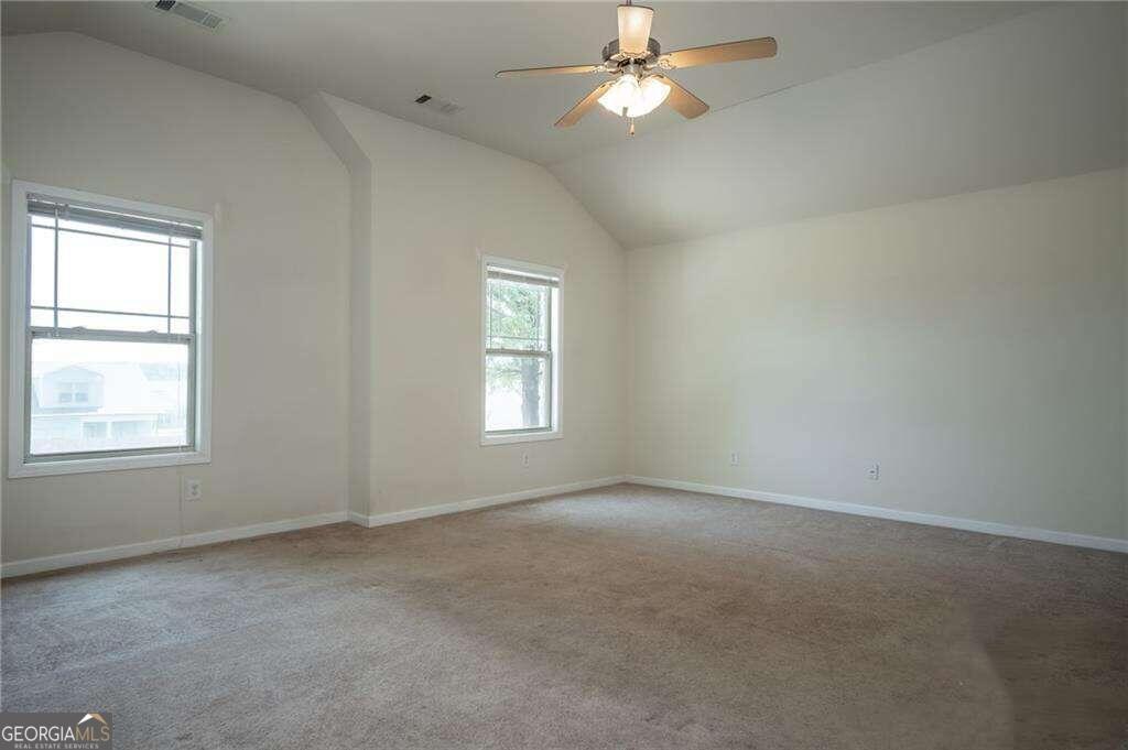 304 Ridge Pointe Drive Athens, GA 30606 - Photo 25 of 50 an empty room with a window and a fan