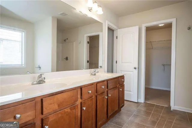 a bathroom with a double vanity sink mirror and double