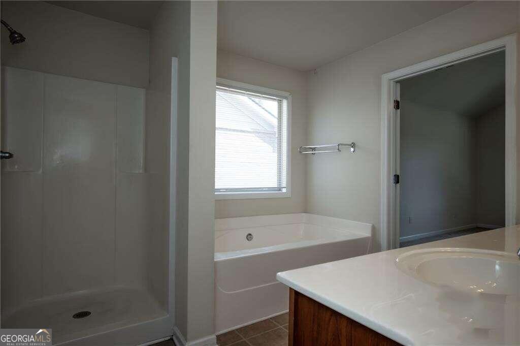 304 Ridge Pointe Drive Athens, GA 30606 - Photo 30 of 50 a bathroom with a bathtub and shower