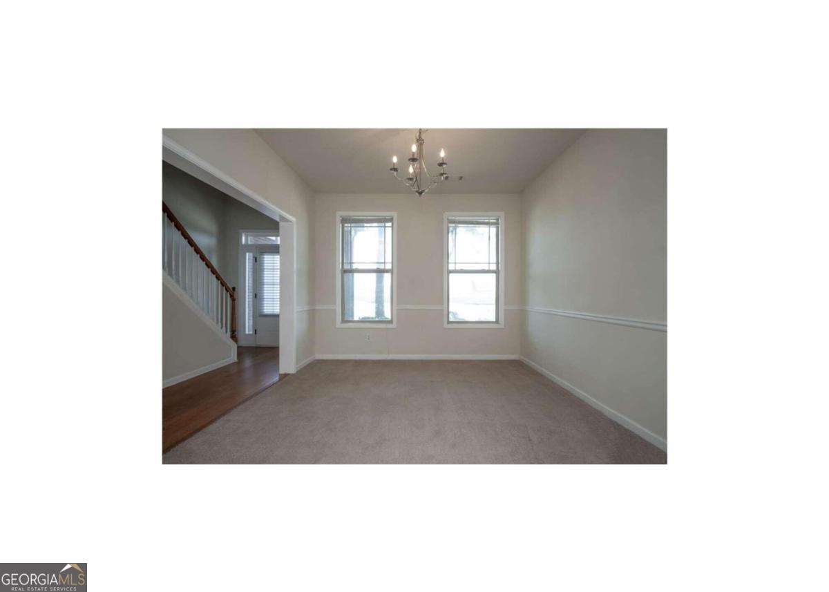 304 Ridge Pointe Drive Athens, GA 30606 - Photo 3 of 50 a upper view of a big room with windows and chandelier