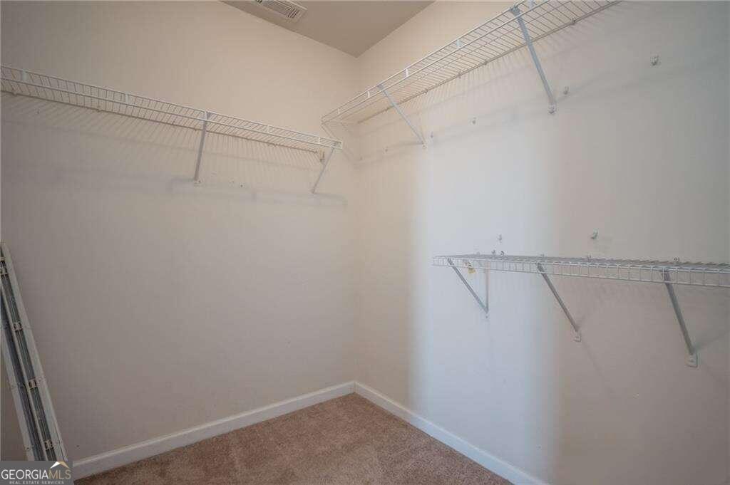 304 Ridge Pointe Drive Athens, GA 30606 - Photo 31 of 50 a view of a room with racks on the wall