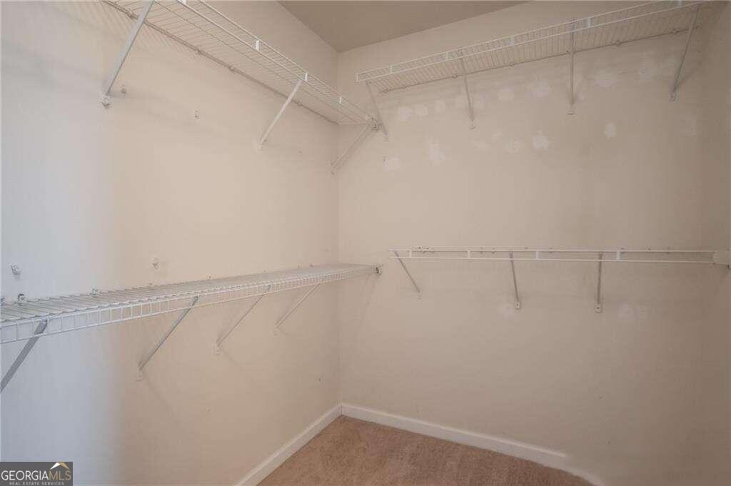 304 Ridge Pointe Drive Athens, GA 30606 - Photo 32 of 50 a view of a room with racks on the wall