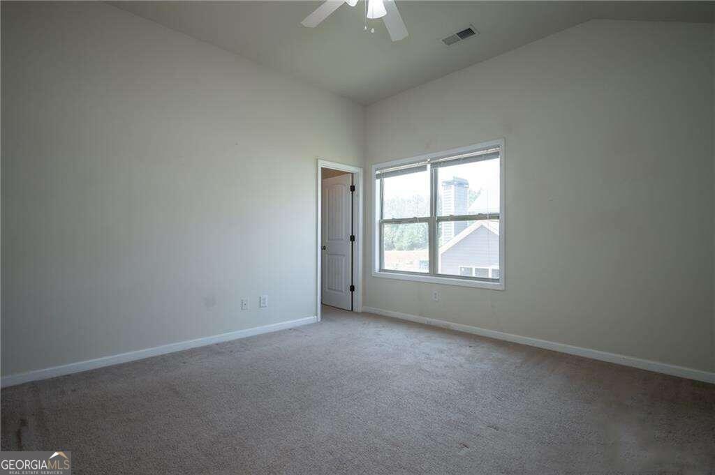 304 Ridge Pointe Drive Athens, GA 30606 - Photo 34 of 50 an empty room with a window and a chandelier fan