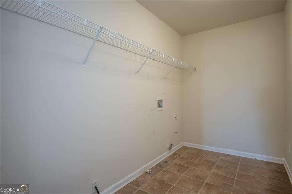 304 Ridge Pointe Drive Athens, GA 30606 - Photo 38 of 50 a view of a room with racks on the wall