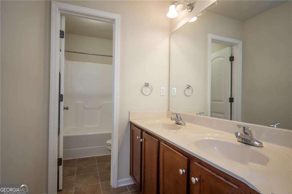 304 Ridge Pointe Drive Athens, GA 30606 - Photo 39 of 50 a bathroom with a double vanity sink mirror and shower