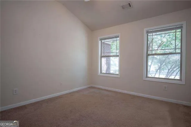 an empty room with windows