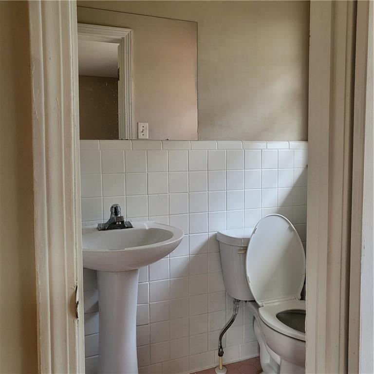 592 Allgood Road Stone Mountain, GA 30083 - Photo 11 of 14 a bathroom with a toilet and a sink