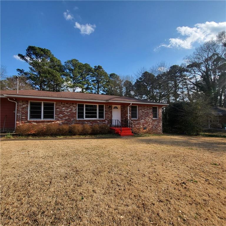 592 Allgood Road Stone Mountain, GA 30083 - Photo 14 of 14 front view of a house with a patio