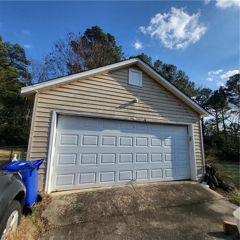 592 Allgood Road Stone Mountain, GA 30083 - Photo 9 of 14 a front view of a house with a garage