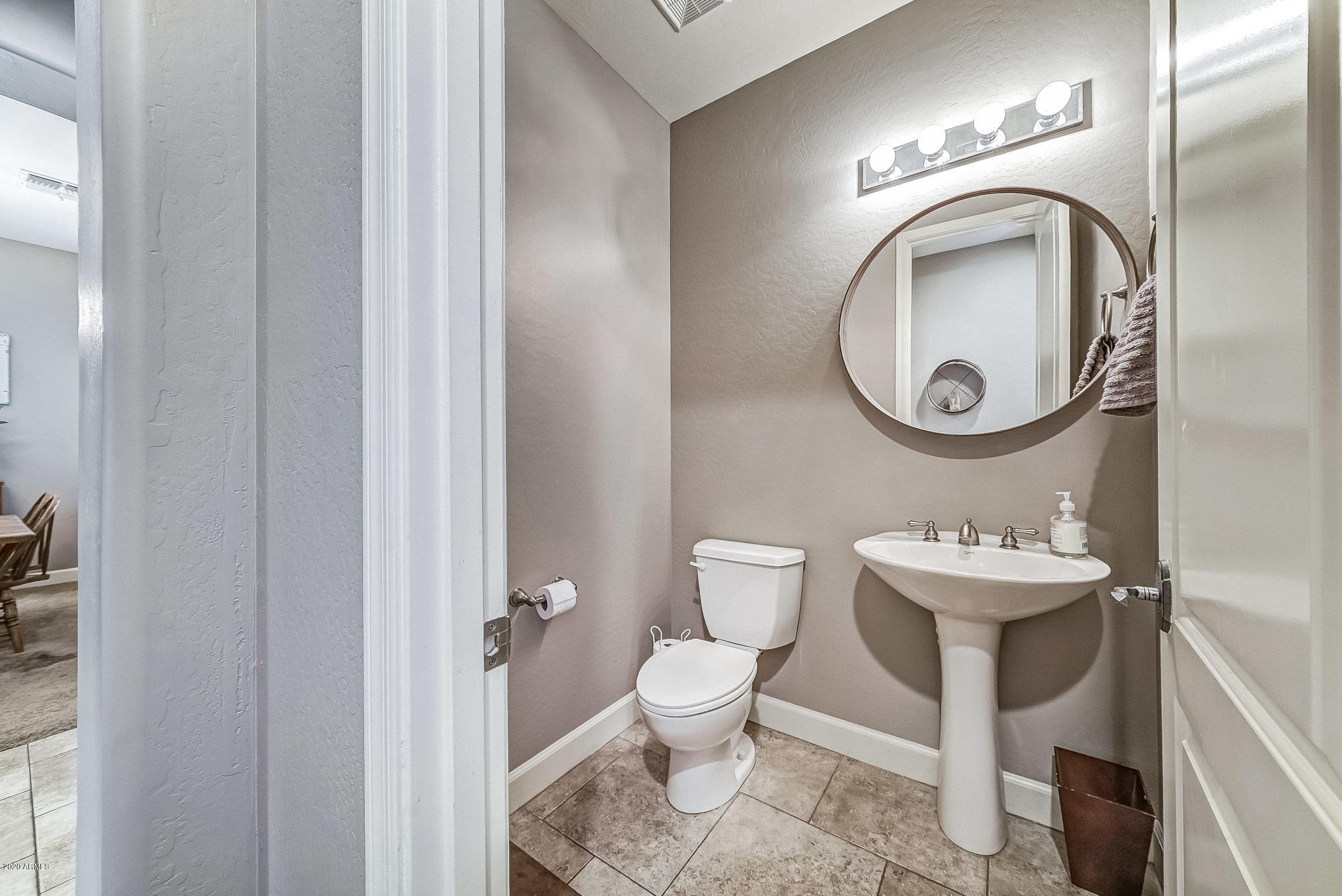 4259 East Los Altos Road Gilbert, AZ 85297 - Photo 20 of 79 a bathroom with a toilet sink and mirror