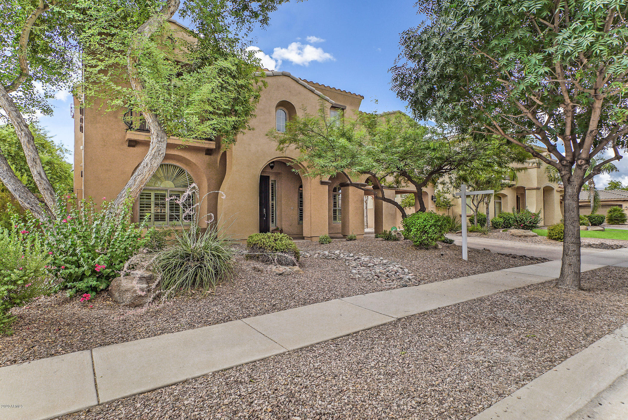 4259 East Los Altos Road Gilbert, AZ 85297 - Photo 7 of 79 a front view of a house with garden