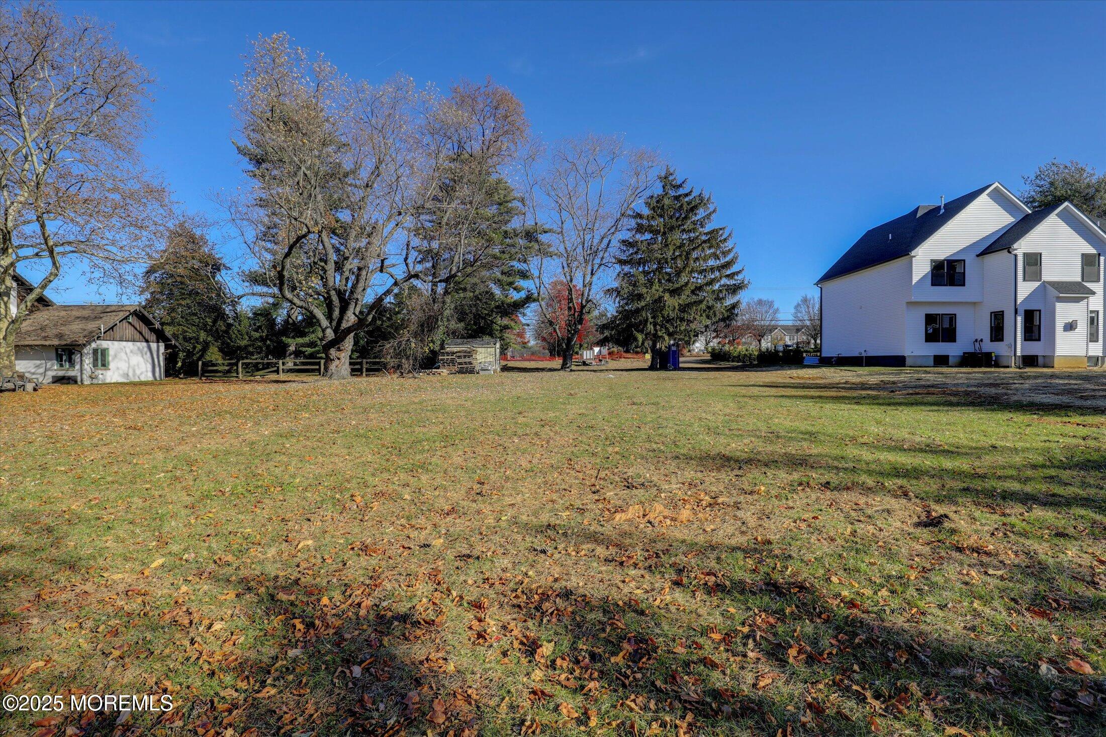 748 Holmdel Road Holmdel, NJ 07733 - Photo 13 of 14 a view of a house with a yard