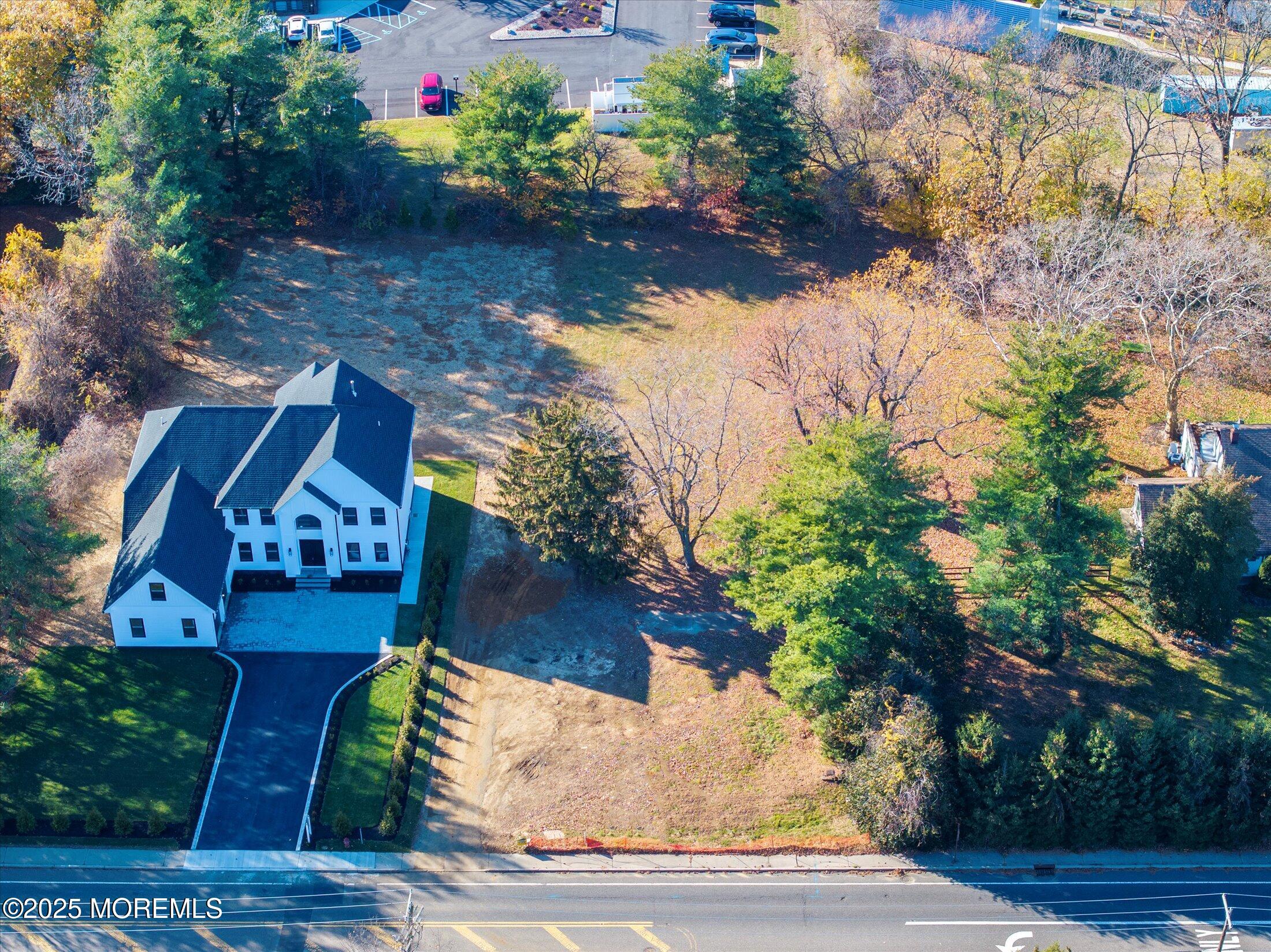 748 Holmdel Road Holmdel, NJ 07733 - Photo 9 of 14 a view of a house with a yard