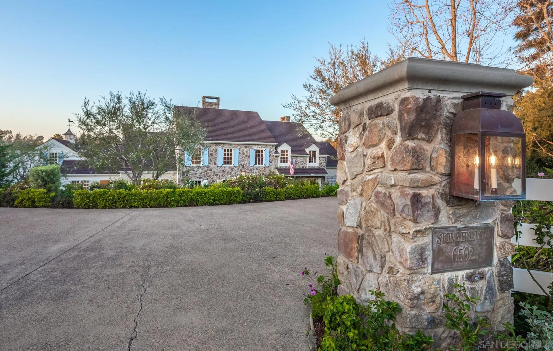 a front view of a house with a yard and a garage
